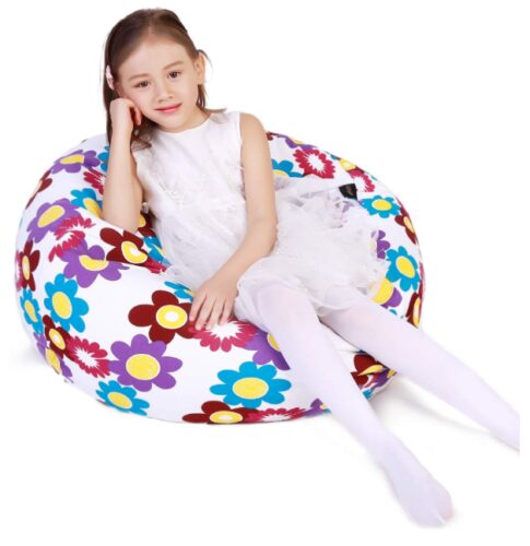 this is an image of a little girl sitting in a storage bean bag chair. 
