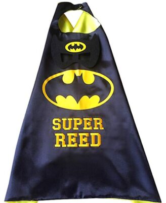 This is an image of kid's superhero cape and mask set in black and yellow colors