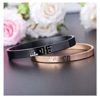 This is an image of a black and rose gold stainless steel couple bracelet. 