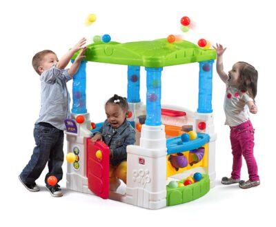 This is an image of kids using a wonderball playhouse made by Step2.