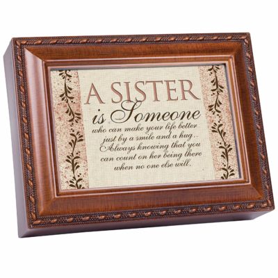 This is an image of a woodgrain finish music or jewelry box for sisters. 