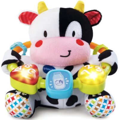 This is an image of baby musical stuffed cow in white and black color