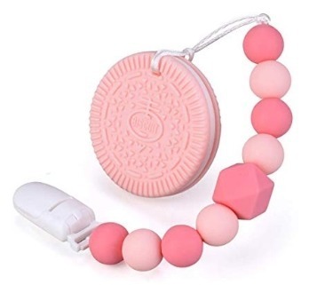 This is an image of baby teether with cookie design in pink color