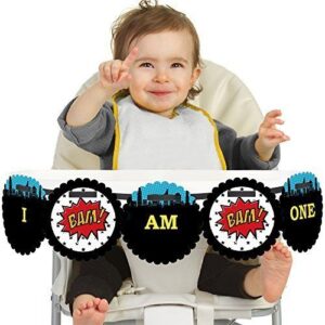birthday party superhero banner around a baby in high chair