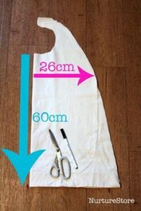 costume diy image with a cape and sissors