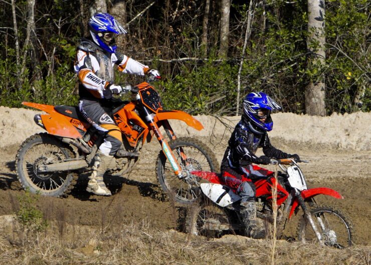 dad and son on dirt bike