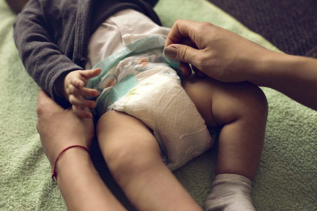 diaper being changed on a baby