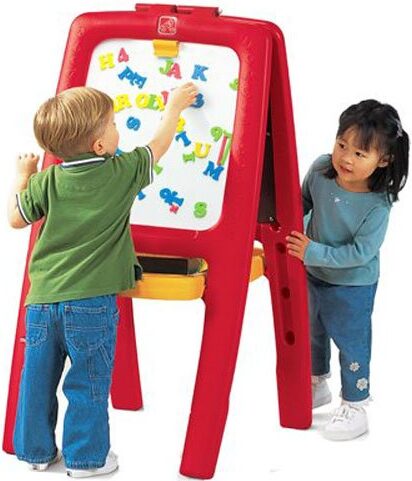 this is an image of two kids playing with a art easel