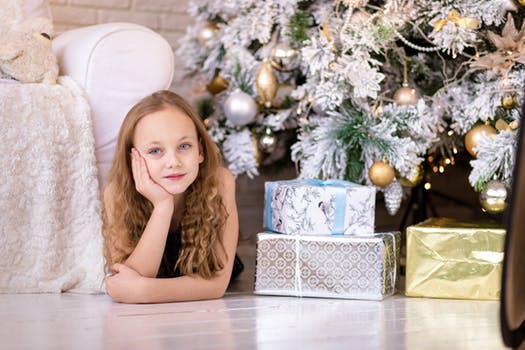 Girl next to gifts and presents