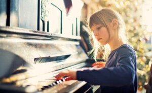 young girl playing piano 