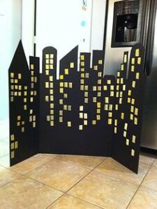Gotham city cardboard cutout with gold glittering windows 