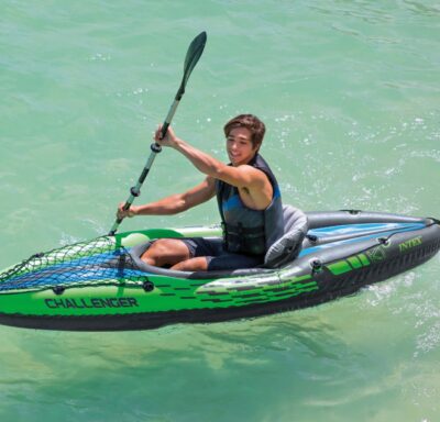 this is an image of a k1 kayak with a boy inside paddling 