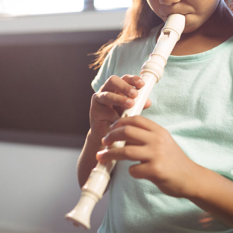 kid playing flute