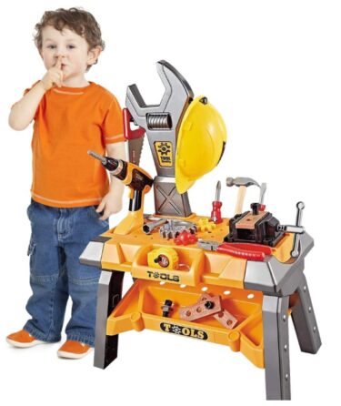 This is an image of kids toy tool workbench with a kid using it