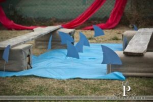 pirate plank and wood with shark fins made from paper