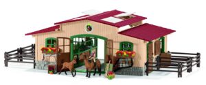 This is an image of a Pink and brown horse stable toy