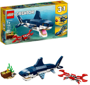 This is an image of kids LEGO Creator 3in1 Deep Sea Creatures 31088 Make a Shark, Squid, Angler Fish, and Crab with this Sea Animal Toy Building Kit (230 Pieces)