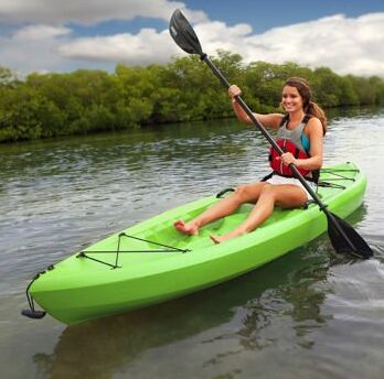 this is an image of a green sit on kayak 