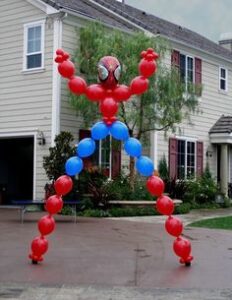 spider man shaped from balloons outside with front garden