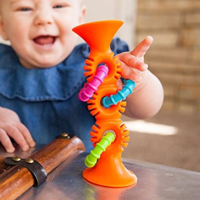 This is an image of baby toy in loops in orange color
