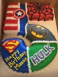 superhero cake made into the number 5 